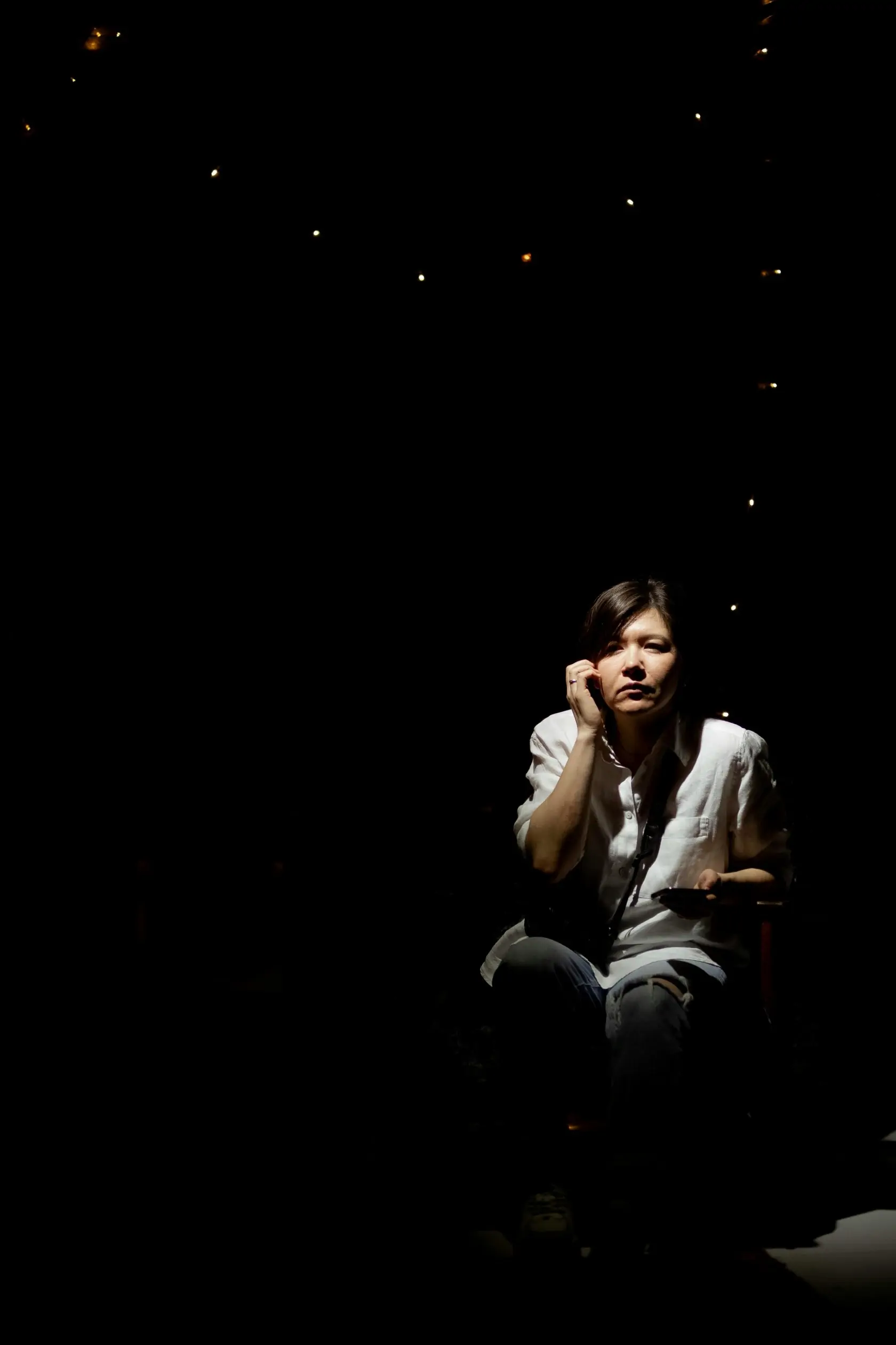 Woman Sitting In Darkness 02